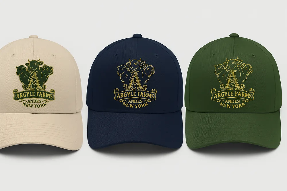 Argyle Farms crest caps in black, sand, navy, and forest colorways